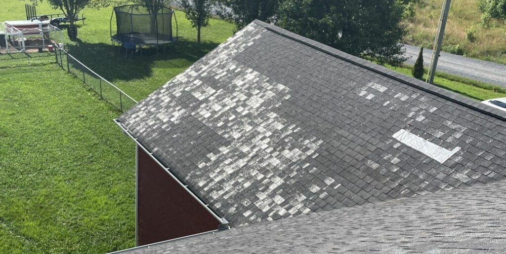 An extreme example of granule loss on an aging roof.