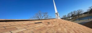 Dark patches are missing shingles that blew off during a storm.